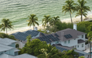 Coastal home with rooftop solar panels installed by Home & Energy Solutions of Florida, combining renewable energy with beachfront living for sustainability.